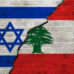 Wall painted with the Israeli flag on the left and the Lebanese flag on the right, cracked down the middle.