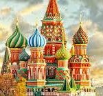 Colorful onion domes of Saint Basil's Cathedral against a cloudy sky in Moscow, Russia.