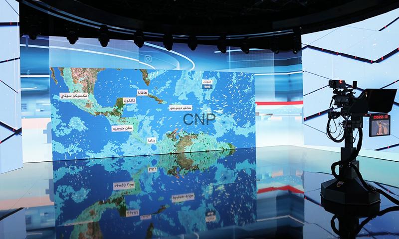 wea - Center News Network Television news studio with a large blue map screen showing 'CNP' and a professional camera on the right.