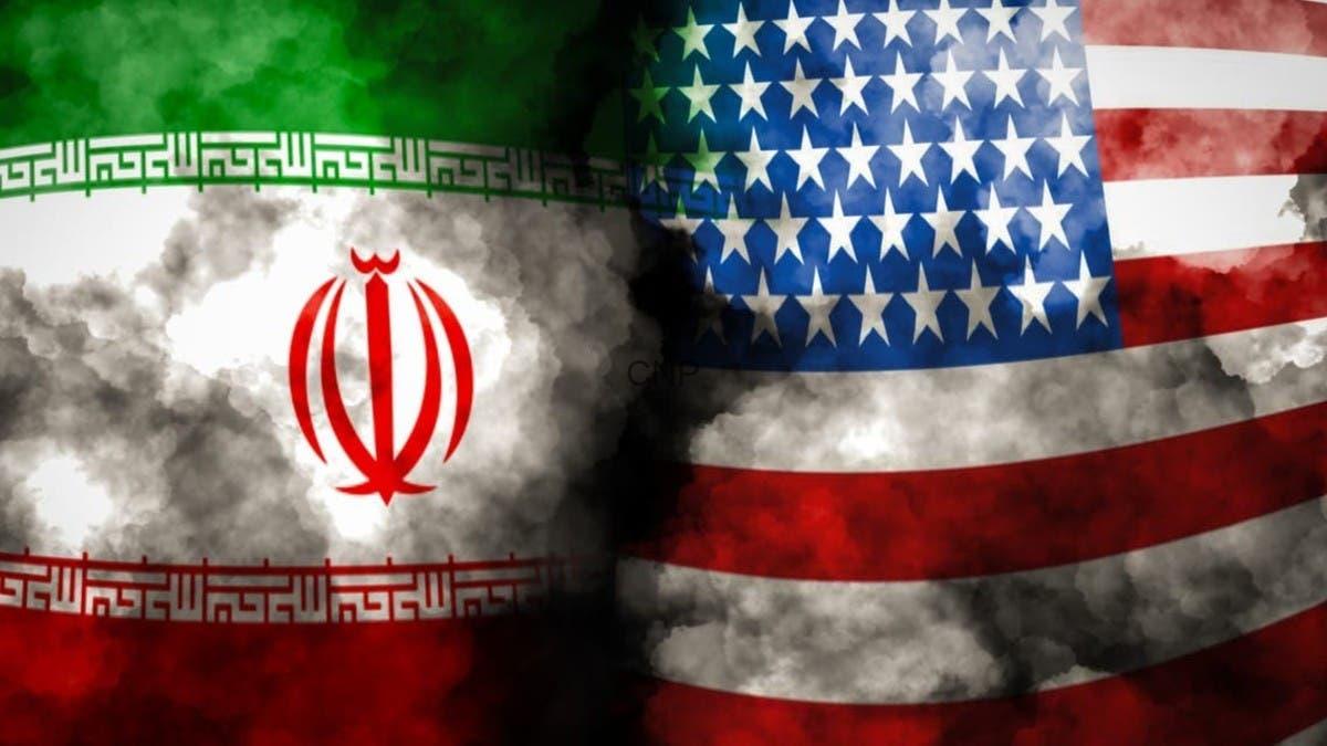 69462aee-1c24-45d1-83b3-62c02f1877ab_16x9_1200x676 - Center News Network Overlapping Iranian and American flags with dark smoke between them, symbolizing tension between the two nations.