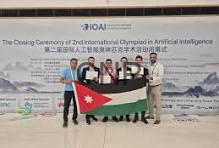 ai - Center News Network Group of people on stage holding a Jordan flag during the closing ceremony of the 2nd International Olympiad in Artificial Intelligence.