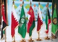 guun - Center News Network Row of colorful flags from different countries and organizations on gold poles displayed at a formal ceremony.