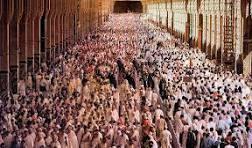 haj - Center News Network Massive crowd of people filling a long indoor corridor, viewed from above.
