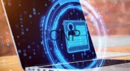 id - Center News Network Laptop with a glowing blue digital lock and shield, symbolizing cybersecurity and data protection.