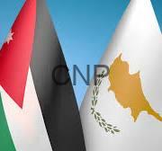 jo c - Center News Network Two national flags fluttering side by side: Jordan (red triangle, black/white/green) and Cyprus (white with gold map and olive branches)