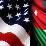 Close-up of two national flags, the United States flag on the left and the Kenyan flag on the right, overlapping.