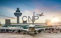 taiaran - Center News Network Airplane on the airport tarmac at sunset, with a control tower and terminal behind and a large 'CNP' sign on the building.