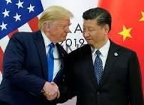 usach - Center News Network Donald Trump and Xi Jinping shake hands at a U.S.–China meeting, with American and Chinese flags in the background.