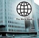 Exterior view of The World Bank headquarters with its globe logo overlay on the building’s facade.