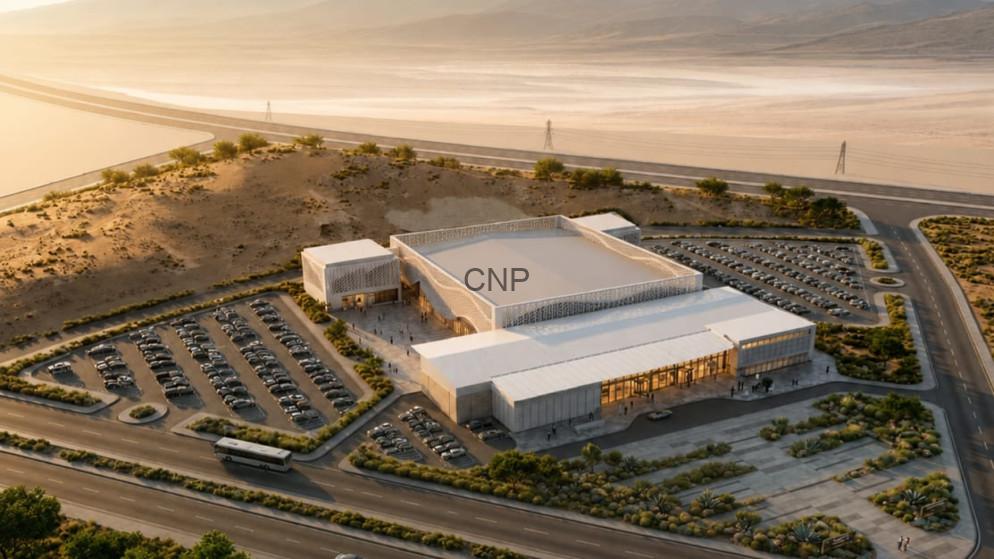 expo - Center News Network Aerial view of a white modern building labeled 'CNP' with extensive surrounding parking in a desert landscape.