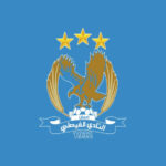 Club emblem with a gold eagle, three on-top gold stars, Arabic banner text, and the year 1932 on a blue background.