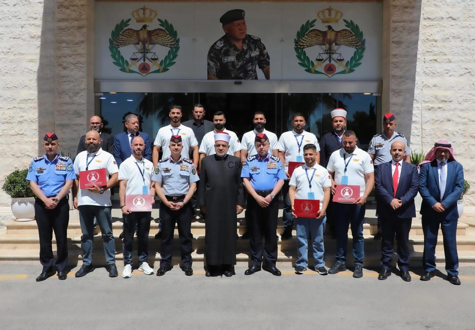 sar - Center News Network Group of uniformed officers and officials posing for a ceremony photo outside a building with emblems above the entrance.
