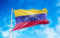 fanz - Center News Network Venezuelan flag waving on a flagpole against a bright blue sky.