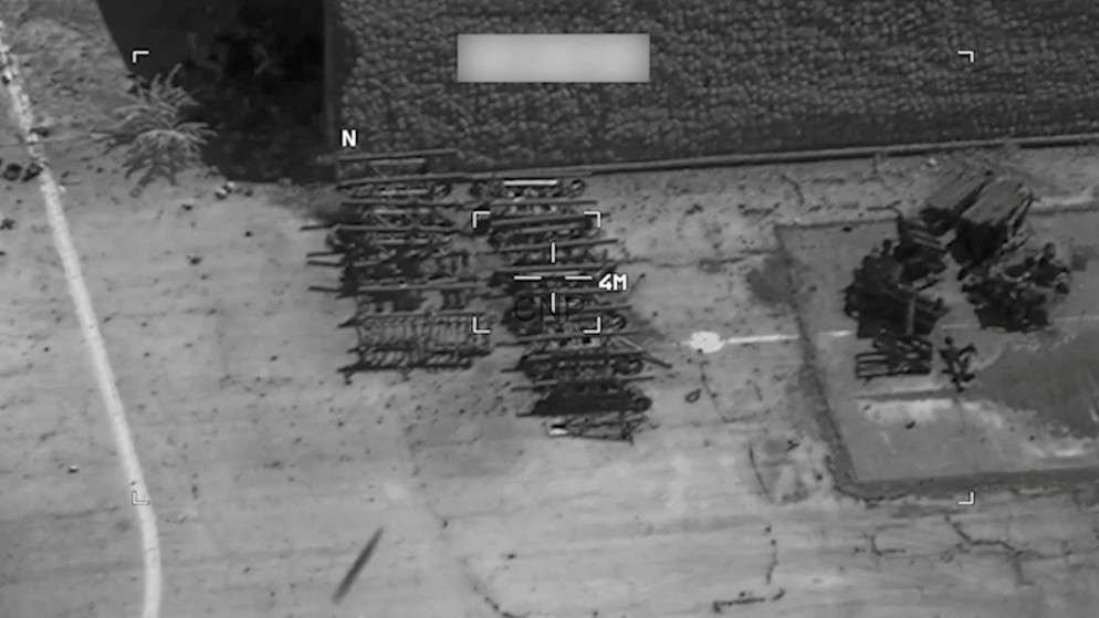 Aerial view of stacked metal scaffolding in a yard beside a building; compass N and a 4 m scale shown.