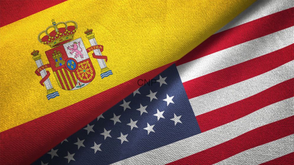 Flag collage combining the Spanish flag with the United States flag, with a faint 'CNP' watermark in the center.