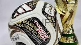 image - Center News Network Collage-style soccer ball in front of a gold trophy, suggesting sports awards or achievement in football/soccer. (informative)