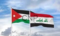 irajo - Center News Network Jordan and Iraq flags waving side by side in a cloudy sky.