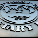 Metal circular plaque featuring the United Nations emblem: a world map with a flying dove and raised surrounding text