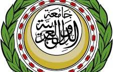 image - Center News Network Circular emblem featuring Arabic calligraphy in the center, surrounded by a gold ring, red dot motif, and a green laurel border comma decorative insignia of Islamic origin.