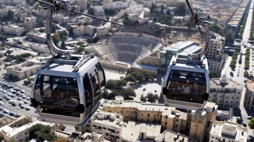 image - Center News Network Two cable cars swing along a cable above an urban landscape, with a large circular stadium visible below.