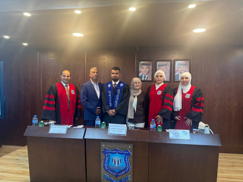 Six people in formal attire and academic robes stand behind a wooden podium with a university crest, posing in a conference room.