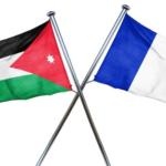 Two crossed flagpoles display the Jordanian flag on the left and the French flag on the right, symbolizing a flag display or diplomacy.